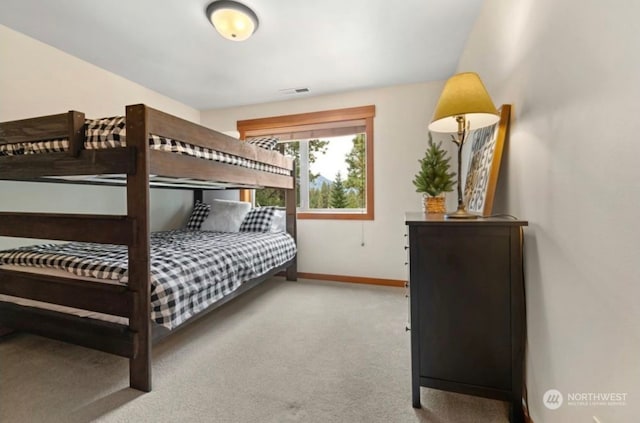 bedroom featuring visible vents, baseboards, and carpet flooring