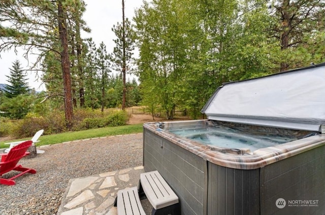 view of patio / terrace with a hot tub