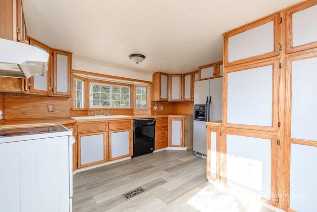 kitchen with electric range, dishwasher, fridge with ice dispenser, light countertops, and under cabinet range hood