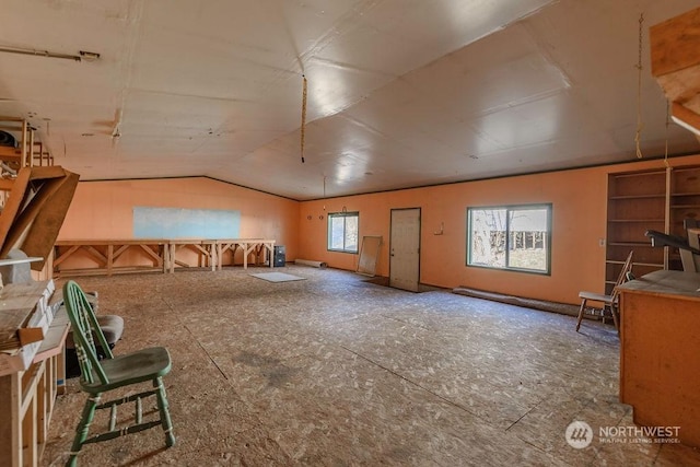 bonus room featuring vaulted ceiling