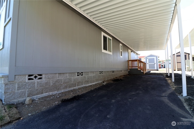 view of side of property with a shed