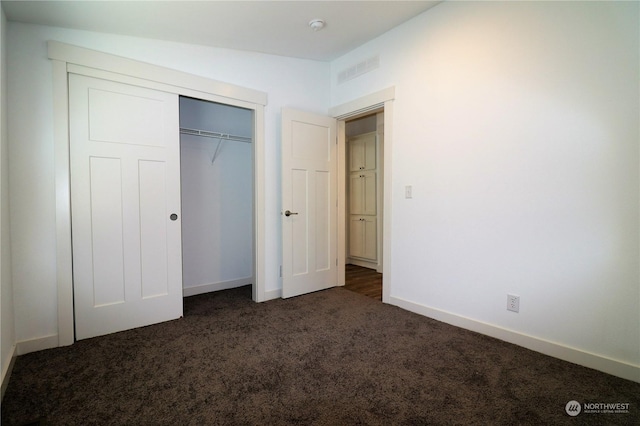 1111 Archwood Dr SW Unit 324, Olympia, WA 98502 - unfurnished bedroom with dark colored carpet, baseboards, and a closet