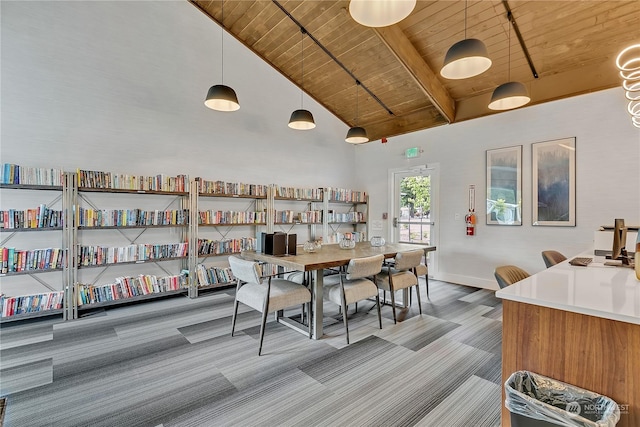 1111 Archwood Dr SW Unit 324, Olympia, WA 98502 - carpeted dining space featuring wooden ceiling with exposed beams, high vaulted ceiling, and baseboards