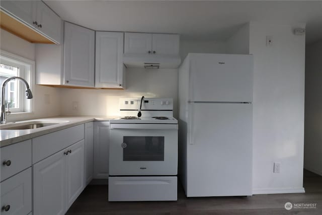 kitchen with white cabinets, white appliances, sink, and dark wood-type flooring