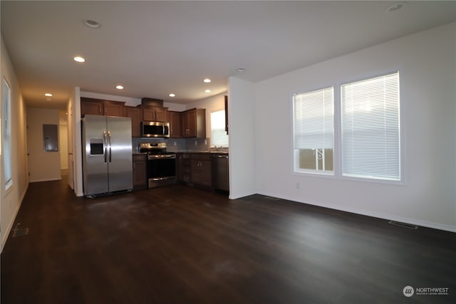 kitchen with dark wood-type flooring and appliances with stainless steel finishes