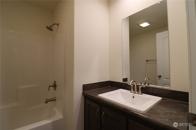 bathroom featuring vanity and tub / shower combination