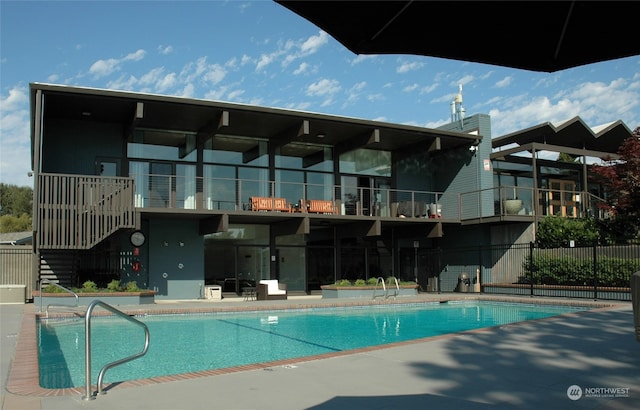 view of swimming pool featuring a patio area