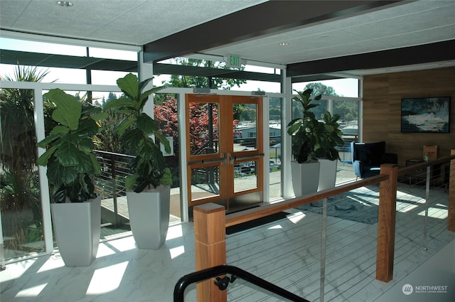 unfurnished sunroom featuring plenty of natural light