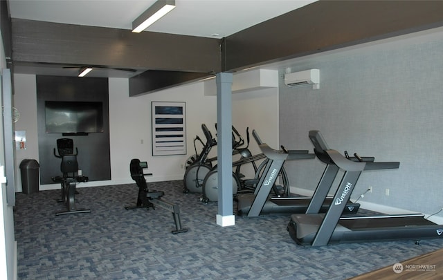 exercise room featuring a wall unit AC