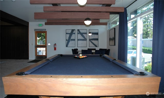 recreation room featuring beamed ceiling, pool table, and a healthy amount of sunlight