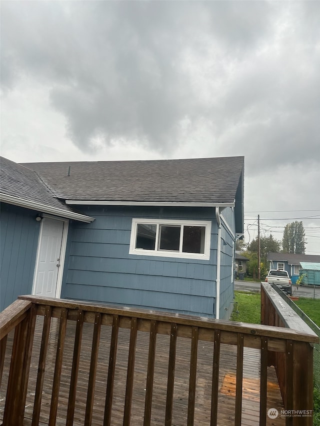 view of side of home featuring a deck