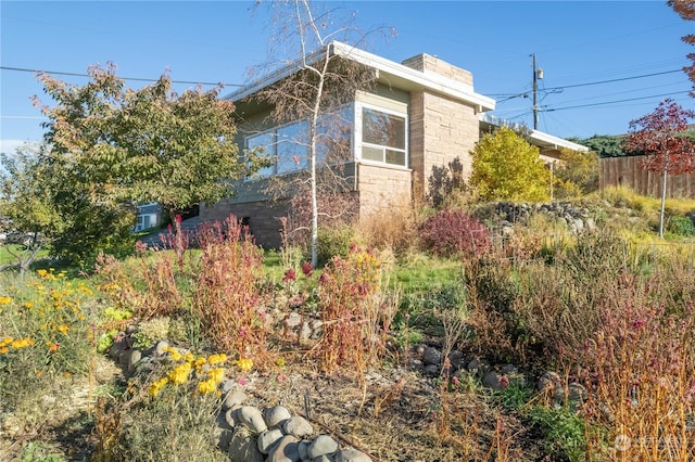 835 S Kiefer Dr, Moses Lake, WA 98837 - view of home's exterior with a chimney