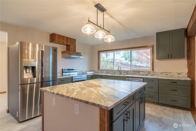 835 S Kiefer Dr, Moses Lake, WA 98837 - kitchen with stainless steel appliances, light stone countertops, a sink, a kitchen island, and exhaust hood