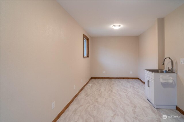 835 S Kiefer Dr, Moses Lake, WA 98837 - kitchen with a sink, white cabinets, dark countertops, and baseboards