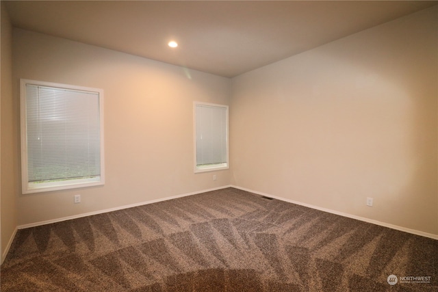 empty room with carpet flooring