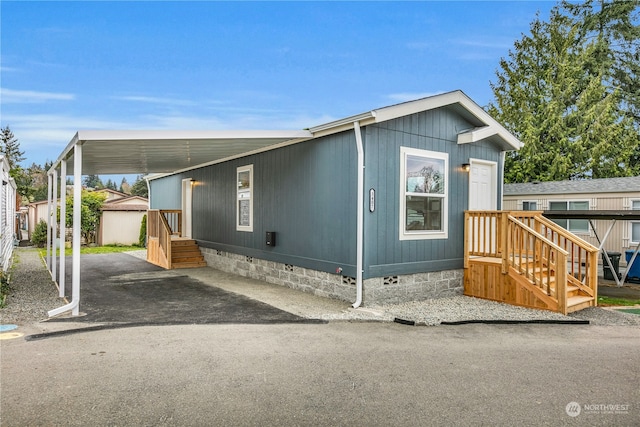 manufactured / mobile home featuring a carport