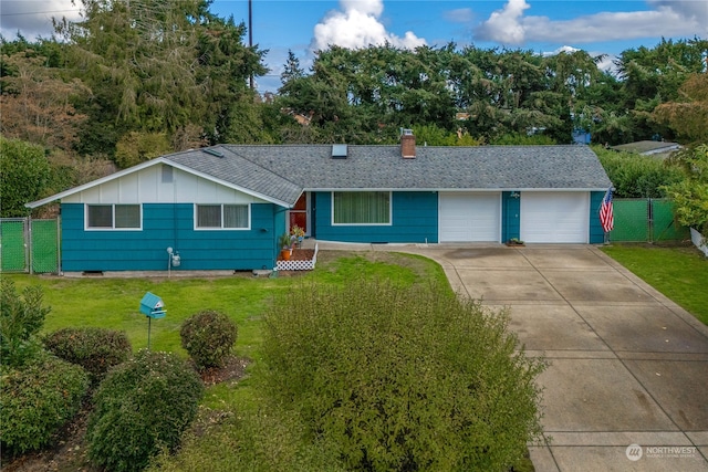 single story home with a front yard and a garage