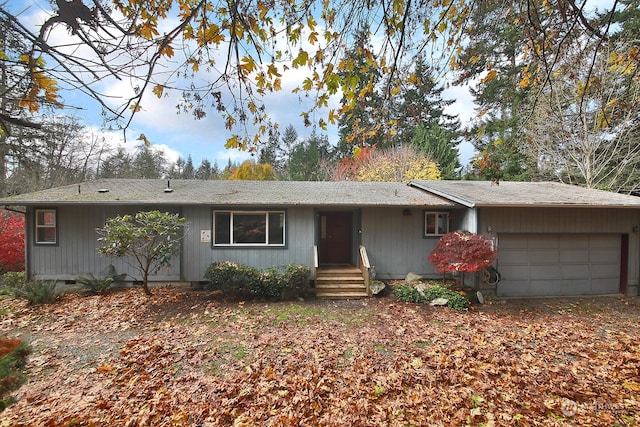 single story home with a garage