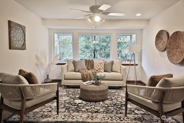 living room featuring hardwood / wood-style floors, a healthy amount of sunlight, and ceiling fan