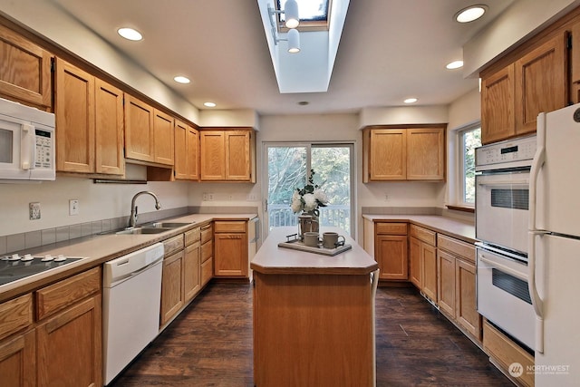 1547 Bismark Ln, Freeland, WA 98249 - kitchen featuring white appliances, a sink, recessed lighting, plenty of natural light, and a kitchen island