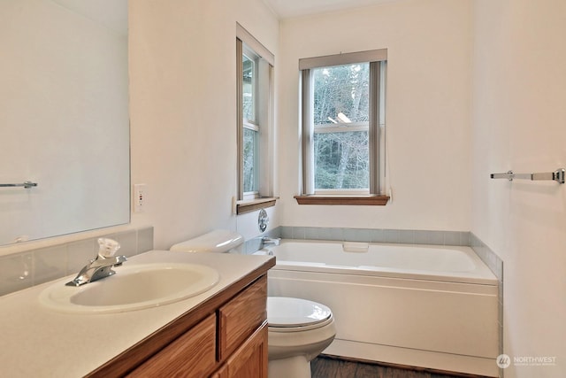 1547 Bismark Ln, Freeland, WA 98249 - full bathroom featuring toilet, a garden tub, and vanity