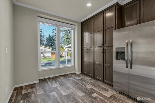 interior space featuring ornamental molding, stainless steel fridge with ice dispenser, dark brown cabinets, and dark hardwood / wood-style floors