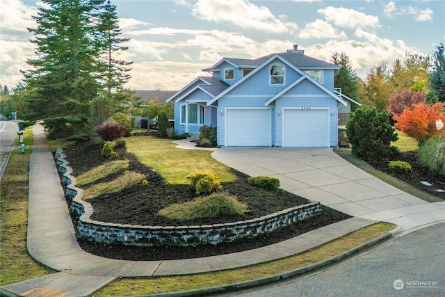 view of front of home with a front yard and a garage