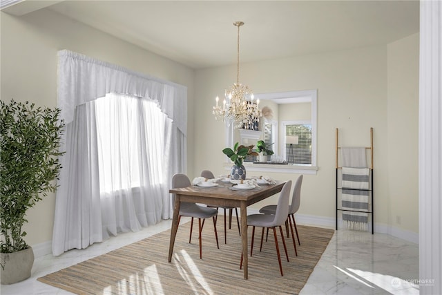 dining space with a notable chandelier