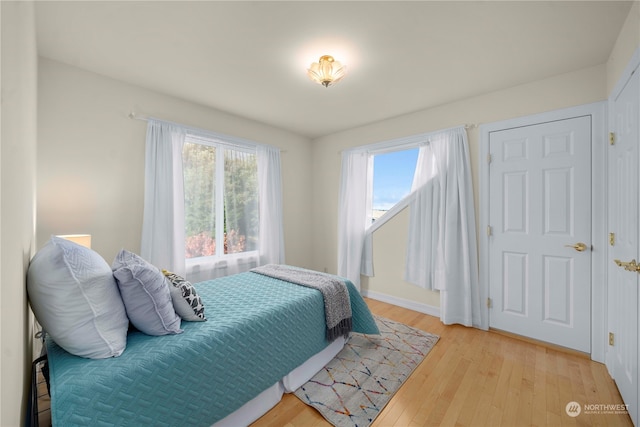 bedroom with light hardwood / wood-style flooring