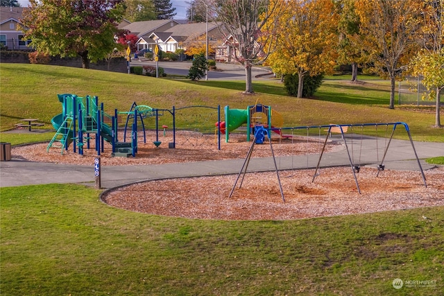 view of playground with a lawn