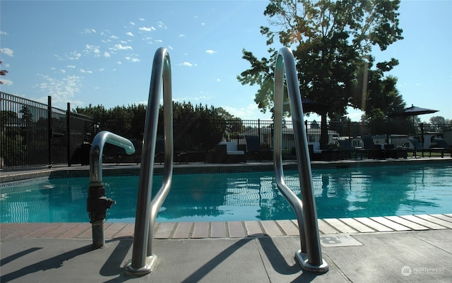 view of swimming pool with sink and a patio area