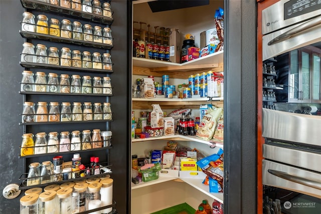 pantry with wine cooler