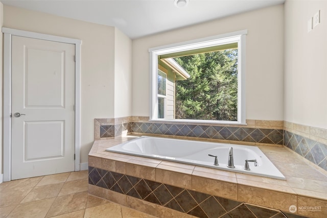 full bathroom featuring tile patterned flooring and a garden tub