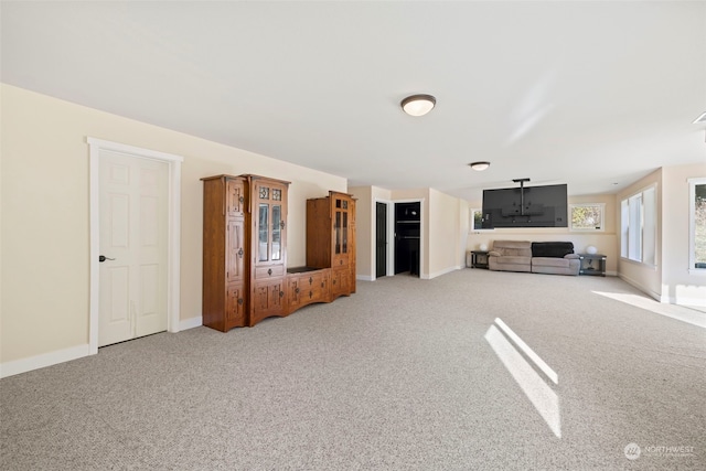 unfurnished living room featuring carpet