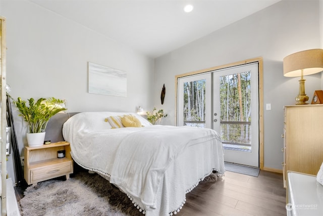 bedroom featuring access to outside, french doors, and dark hardwood / wood-style floors