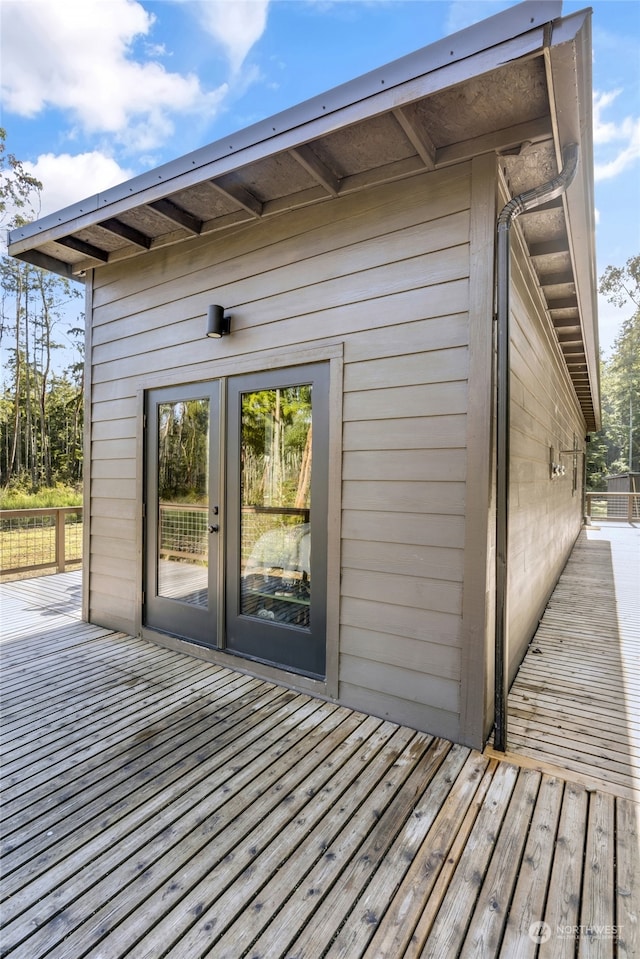 wooden deck featuring french doors