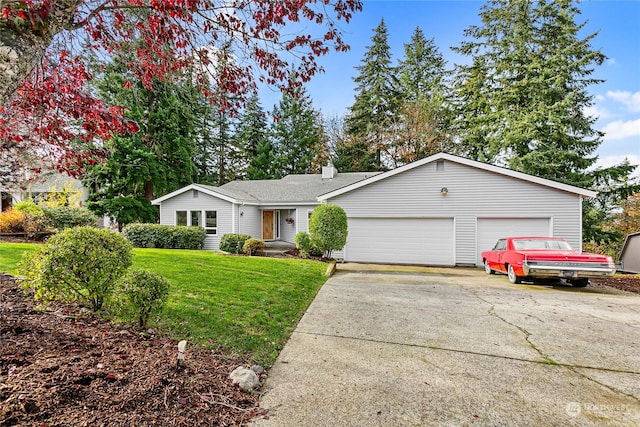 ranch-style home featuring a garage and a front lawn