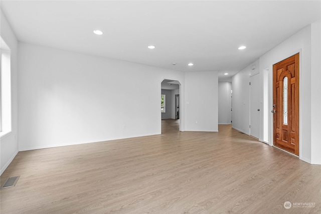 unfurnished living room featuring light wood-type flooring