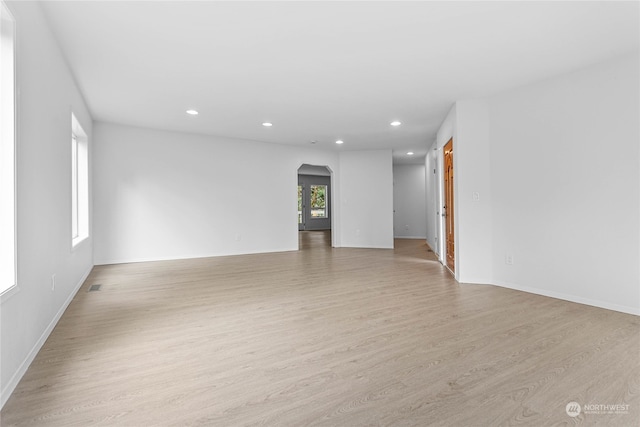 spare room featuring light hardwood / wood-style floors