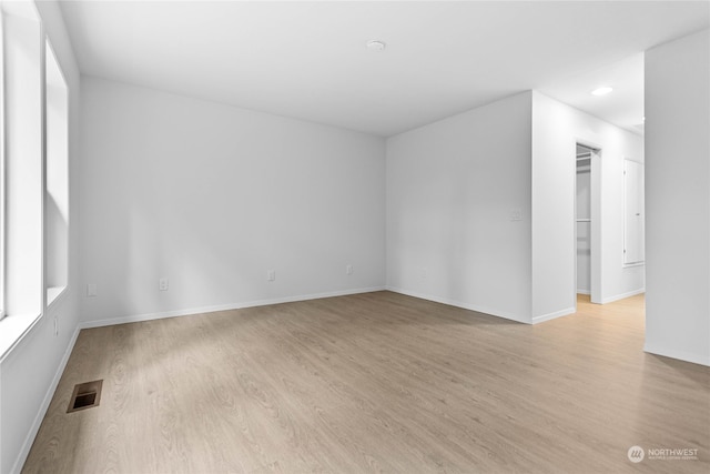 spare room with light wood-type flooring