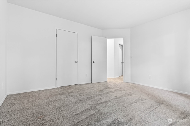 unfurnished bedroom featuring carpet flooring