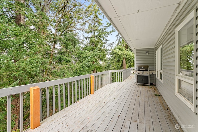 wooden terrace featuring area for grilling