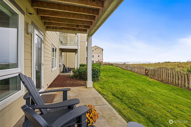 view of yard featuring a patio and a balcony