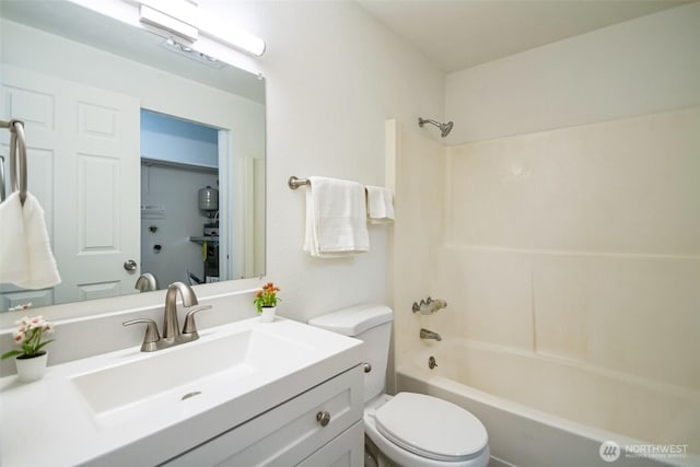 full bathroom featuring shower / bath combination, toilet, and vanity