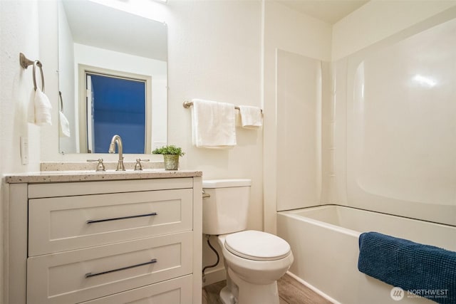 full bathroom with vanity, toilet, and wood finished floors