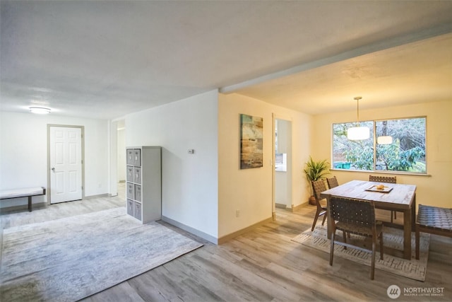 dining room with wood finished floors and baseboards