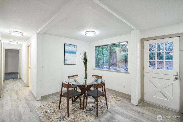 dining area with light wood-style floors