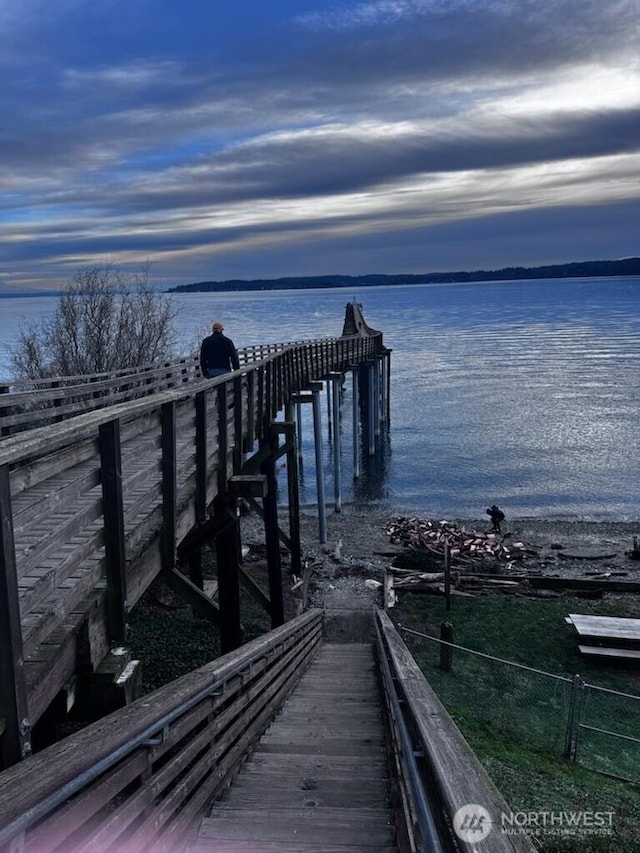 dock area featuring a water view