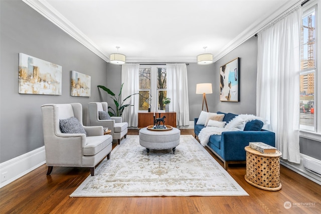 living room with hardwood / wood-style floors and ornamental molding