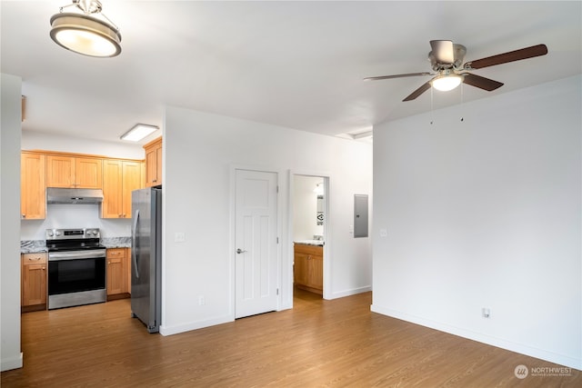 kitchen with ceiling fan, appliances with stainless steel finishes, electric panel, and light wood-type flooring